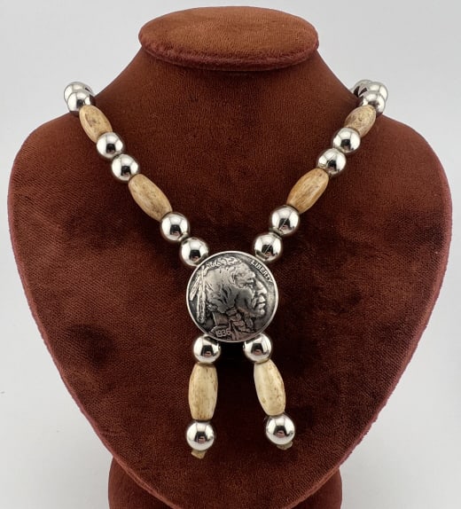 Vintage Native American Bead Strand w 1936 Nickel: Vintage Native American Bead Strand w 1936 Nickel. Strand made with bone beads and a 1936 Buffalo nickel. Measures 17 inches in length.