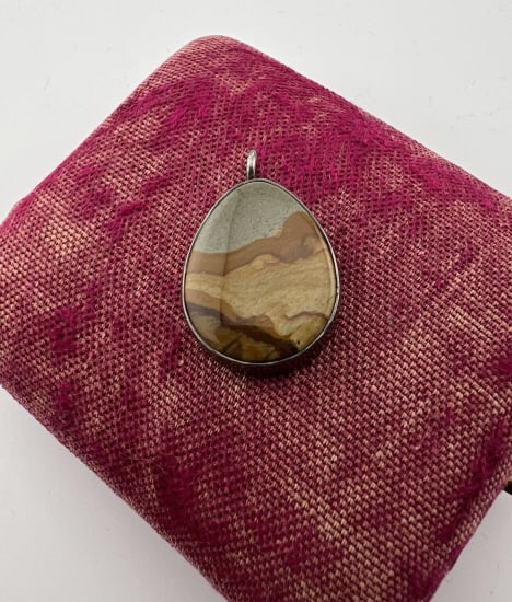 Native American Sterling Silver & Jasper Pendant: Native American Sterling Silver & Jasper Pendant. Bezel set landscape jasper in sterling silver. Measures just over 1 inch in length.
