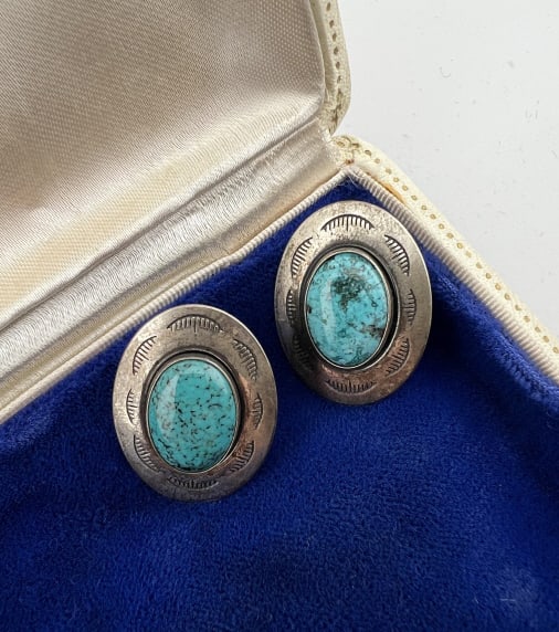 Signed Native American Sterling Turquoise Earrings: Pair of Signed Native American Sterling Silver & Turquoise Earrings. Signed and hallmarked on the back. Each measures 1 inch in length.