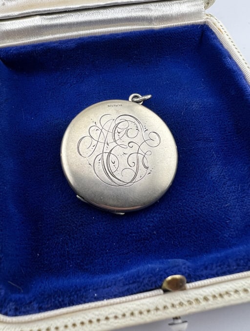 Antique Art Nouveau Sterling Silver Locket Pendant: Antique Art Nouveau Sterling Silver Locket Pendant. Antique circa 1900 sterling silver locket necklace pendant with an Art Nouveau style monogram. Hallmarked. Measures 1.5 inches in length with the ba