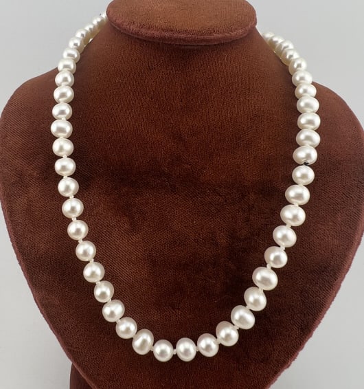 Vintage Sterling Cultured Baroque Pearl Necklace: Vintage Sterling Cultured Baroque Pearl Necklace Strand. Hand knotted on white silk thread with hallmarked sterling silver clasp. Baroque form cultured high luster pearls of approximately 5-6mm in wid