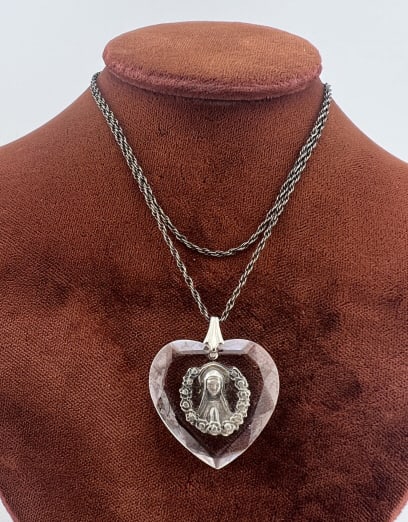 Antique Sterling Silver Crystal Religious Necklace: Antique Sterling Silver Crystal Religious Necklace. Faceted crystal heart necklace pendant with Virgin Mary mount, on sterling silver rope twist chain, hallmarked on clasp. Chain measures 18 inches in