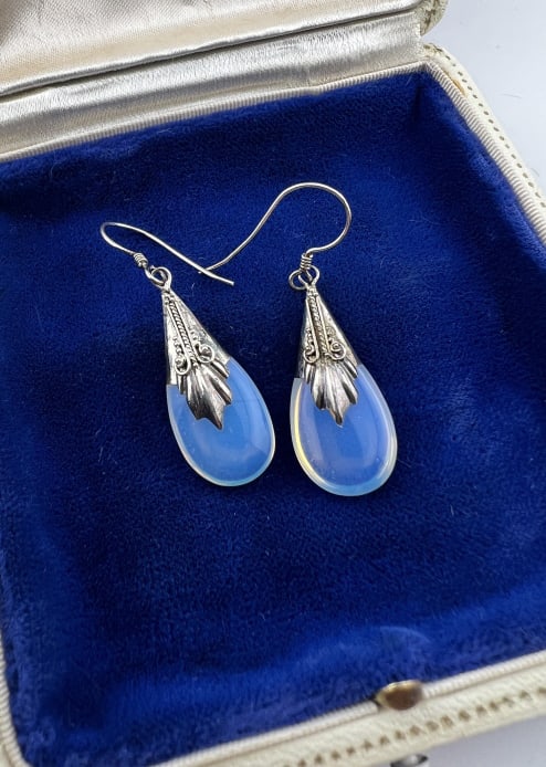 Pair Sterling Silver & Moonstone Pendant Earrings: Pair Sterling Silver & Moonstone Pendant Earrings. Hallmarked. Each set with a moonstone drop. Each measures 1.75 inches in length.