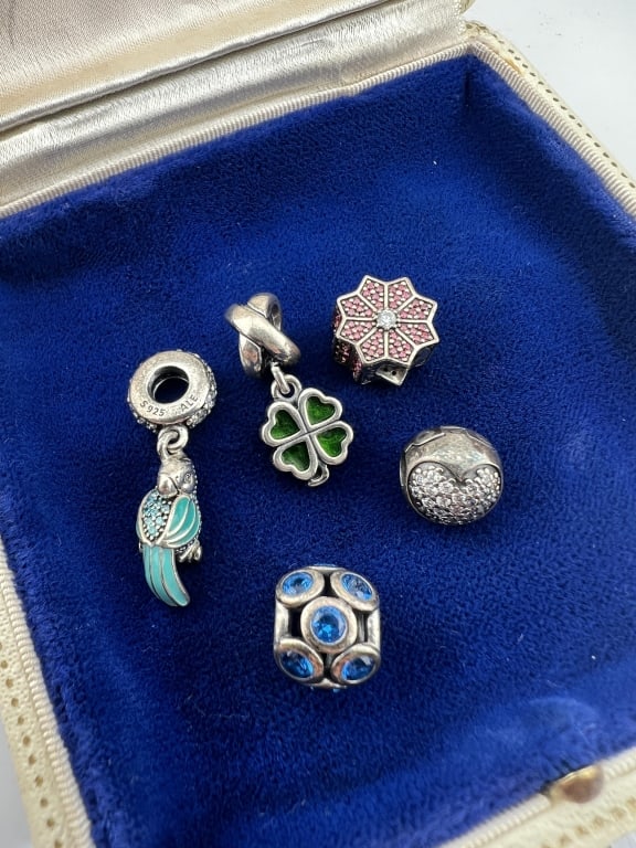 5 Sterling Silver Pandora Bracelet Bead Charms: Collection of Five Sterling Silver Pandora Bracelet Bead Charms. Signed / hallmarked on two examples. The parrot charm measures just under 1.25 inches in length.