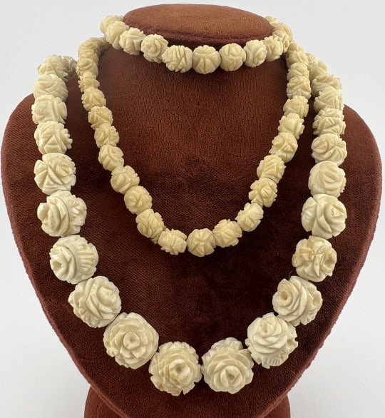 Antique Hand Carved Bone Floral Motif Necklace: Antique Hand Carved Bone Floral Motif Necklace. Likely cow or ox bone. Rose flower motif to the hand carved beads. Measures just over 34 inches in length.