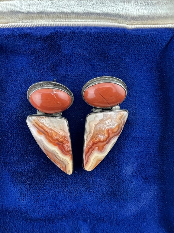Pair of Sterling Silver Jasper & Agate Earrings: Pair of Sterling Silver Jasper & Agate Earrings. Signed / hallmarked on the backs. Set with cabochon red jasper stones and triangle agate stones in bezel settings. Each measures 1.5 inches in length.