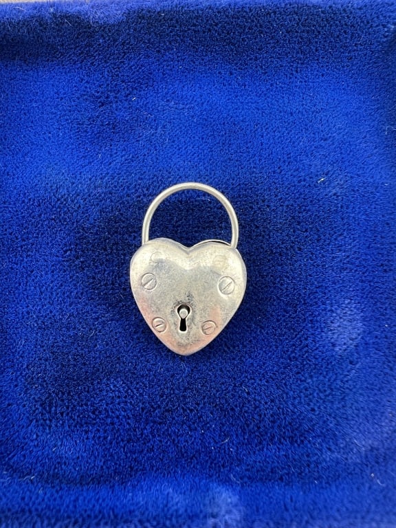 Sterling Silver Heart Form Padlock Clasp Pendant: Sterling Silver Heart Form Padlock Clasp or Pendant / Charm. Hallmarked. The arched top opens as a clasp. Measures 1 inch in length.