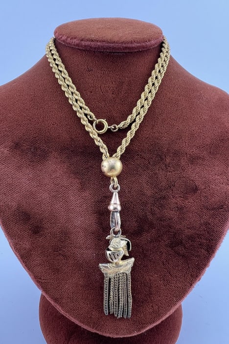 Antique 19th C Gold Filled Necklace Chain w Tassel: Antique 19th C Gold Filled Necklace Chain w Knight in Armor Motif Tassel Pendant. Yellow gold filled rope twist necklace chain with spring ring clasp and dog clip for pendant, holding an articulated a