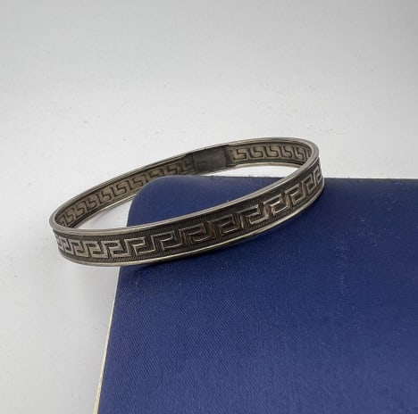 Antique 19th C Sterling Silver Greek Key Bracelet: Antique 19th C Sterling Silver Greek Key Bracelet. Bangle bracelet. Hallmarked. Measures 2.5 inches across the interior opening.