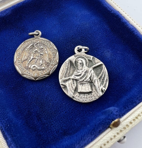 Vintage Sterling Silver Religious Medal Pendants: Two Vintage Sterling Silver Religious Medal Pendants. Hallmarked. One of Saint Elmo and other Michael the Archangel. Each approximately 1.25 inches in length.