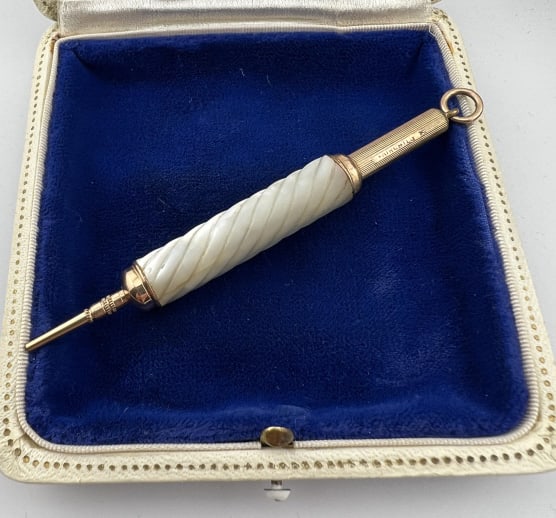 Antique 19th C Gold Filled Mother of Pearl Pencil: Antique 19th C Gold Filled & Carved Mother of Pearl Chatelaine Pencil Pendant. Pulls open to extend to larger size. Measures 2.25 inches when closed, 3.75 inches in length when open.
