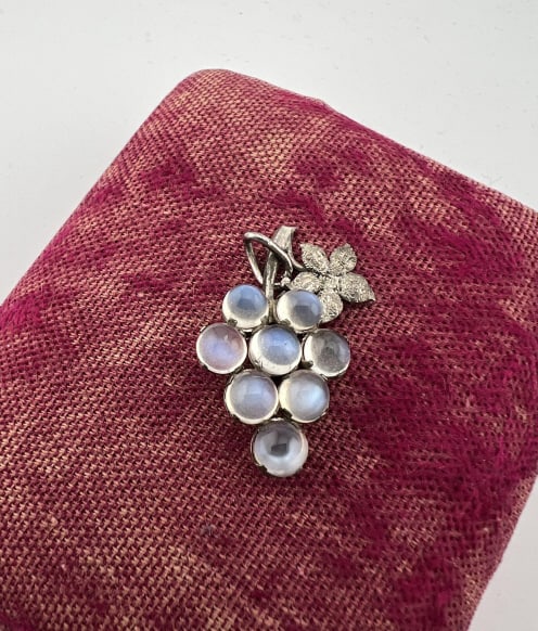 Antique Sterling Silver Moonstone Cabochon Pendant: Antique Arts & Crafts Style Sterling Silver Moonstone Cabochon Pendant. Grape cluster design. Measures 1.25 inches in length.