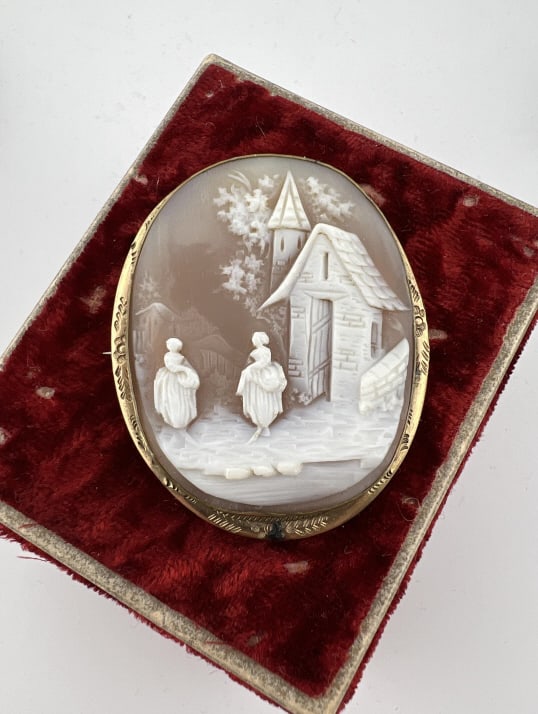 Antique 19th C Pastoral Castle Scene Cameo Brooch: Antique 19th C Pastoral Castle Scene Cameo Brooch. Gold filled frame. Having a finely hand carved natural sea shell cameo with a scene of two women in front of a castle in landscape. Measures nearly 2