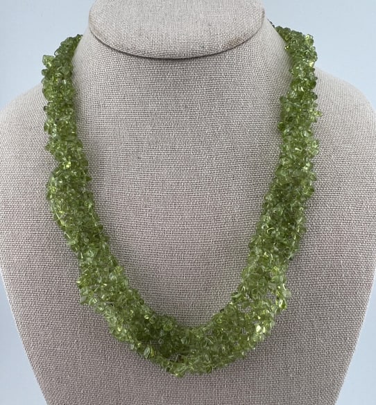 Handmade Woven Strand Peridot Bead Necklace: Handmade Woven Strand Peridot Bead Necklace. Woven / intertwined strands of tumbled peridot beads. Measures just under 20 inches in length.