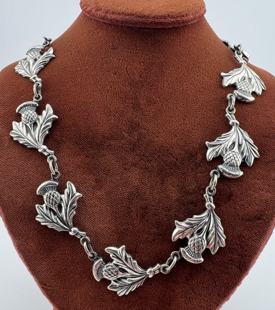 Vintage Sterling Silver Scottish Thistle Necklace: Vintage Sterling Silver Scottish Thistle Necklace. Hallmarked. Articulated sterling silver necklace. Measures approximately 16 inches in length. Weighs approximately 28 grams.