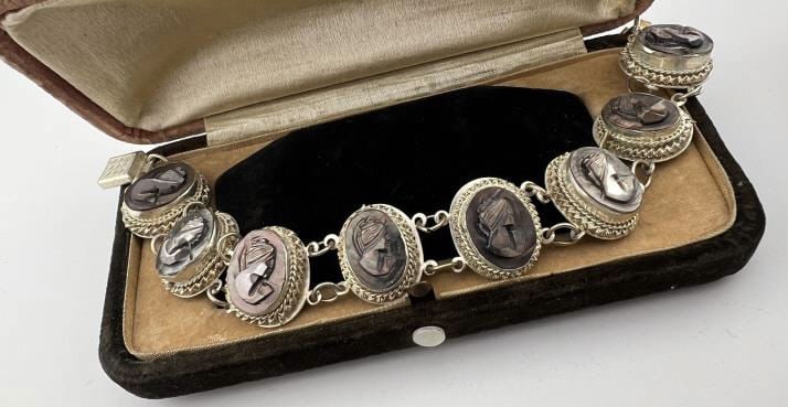 Vintage 800 Silver & Abalone Shell Cameo Bracelet: Vintage 800 Silver & Abalone Shell Cameo Bracelet. Articulated panel bracelet with eight portrait cameos. Hallmarked. Measures 7.5 inches in length.