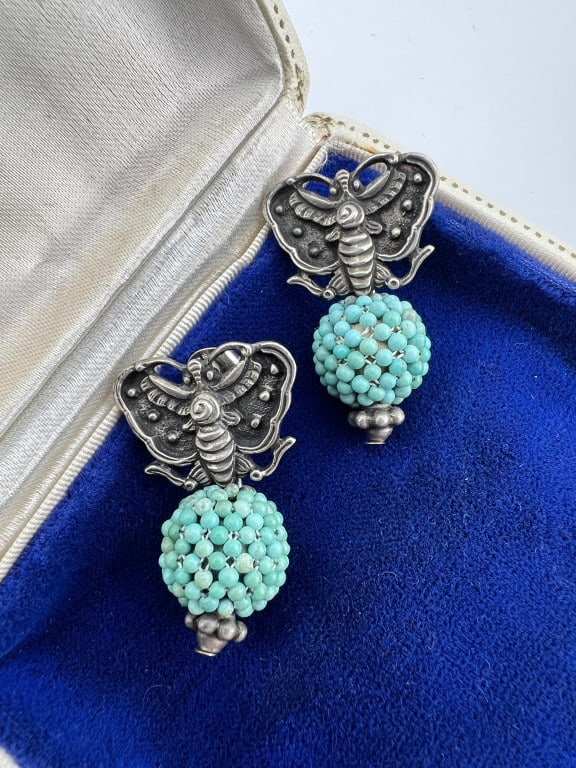Pair Amy Kahn Russell Sterling Turquoise Earrings: Pair Amy Kahn Russell Sterling Turquoise Earrings. Butterfly motif. Signed and hallmarked on the backs. Each measures 1.25 inches in length.