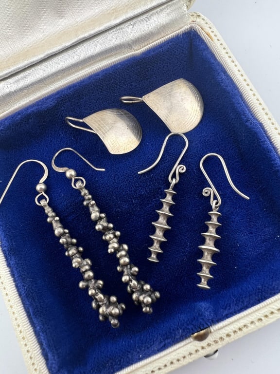 Sterling Silver Three Pairs of Modernist Earrings: Sterling Silver Three Pairs of Modernist Earrings. In sculptural and engraved designs. Longest pair measures just over 2 inches in length.