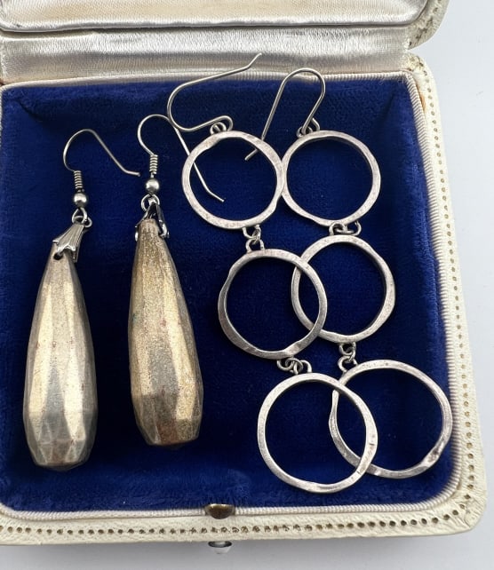 Two Pairs of Vintage Modernist Silver Earrings: Two Pairs of Vintage Modernist Silver Earrings. One pair as pendant drops and one as multi ring design. These measure 2.5 and 3.25 inches in length.