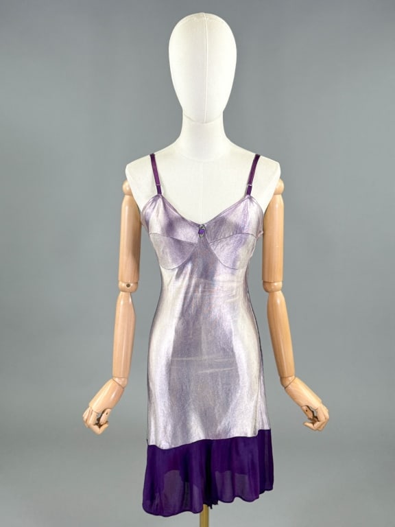 Vintage 1940s Purple Lingerie Step In Teddy Romper: Vintage 1940s Purple Lingerie Step In Teddy Romper having side hook closure. Measuring 34 - 38 inch bust, 28 - 34 inch waist, 36 inch total length. Wear throughout as shown, appears to be over dyed an