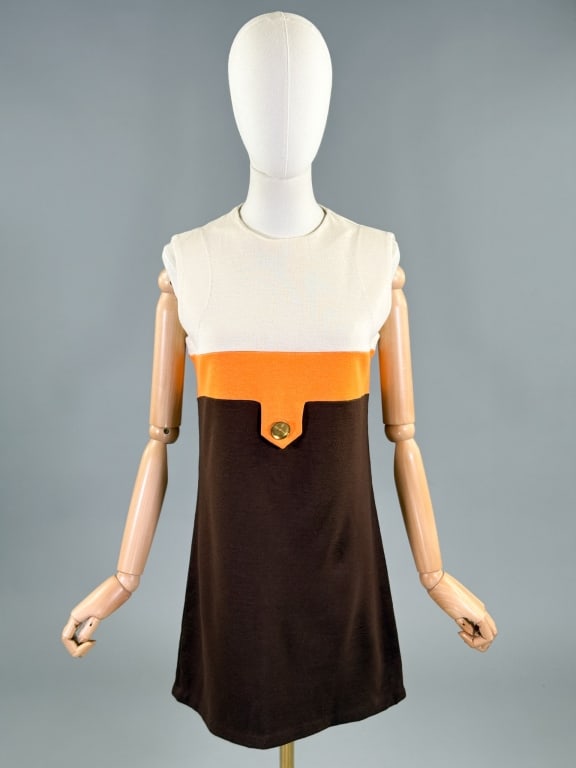 Vintage 1960s Color Block Knit Mod Mini Dress: Vintage 1960s Color Block Knit Mod Mini Dress having a-line shape and button detail at front with center back zip closure. Measuring 34 - 40 inch bust, 34 - 40 inch waist, 32 inches long with stretch 