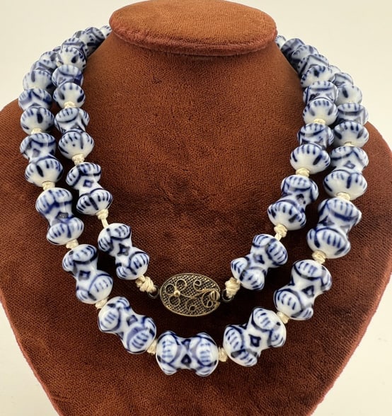 Estate Chinese Blue & White Porcelain Necklace: Estate Chinese Blue & White Porcelain Bead Necklace w Silver Clasp. Hand knotted, hand painted blue on white porcelain beads, silver filigree floral motif clasp marked SILVER. Measures approximately 2