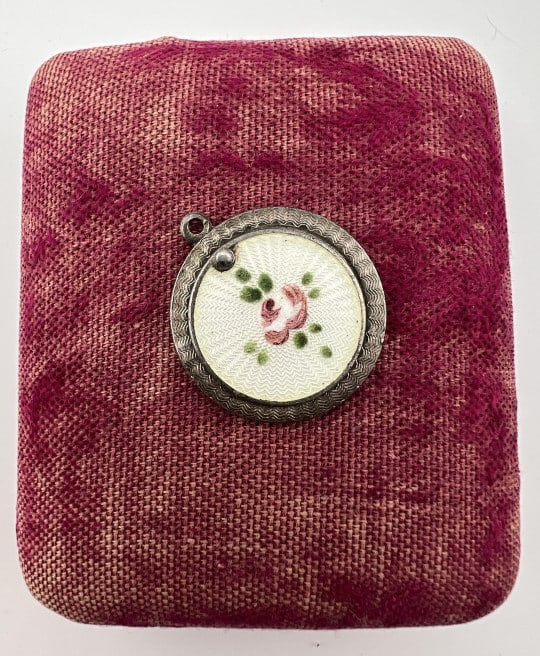 Antique Sterling Guilloche Enamel Reliquary Locket: Antique Sterling Silver Guilloche Enamel Reliquary Locket. Religious Medals inside and on the back. Hallmarked. Measures just over 1 inch in length.