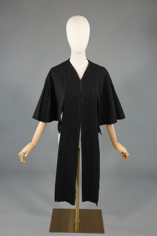 Antique Victorian Black Wool Mantle Cape Shawl: Antique Victorian Black Wool Mantle Cape Shawl having braided trim throughout as shown with long details at front. Closes at center front with hooks. One size fits most, measuring approximately 40 inc