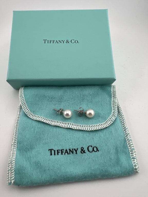 Tiffany & Co 18kt White Gold & Pearl Stud Earrings: Tiffany & Co 18kt White Gold & Pearl Stud Earrings. Hallmarked 750 and T & Co. Comes with original box and dust cover.