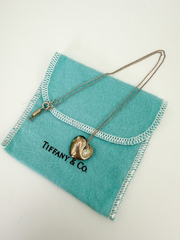 Tiffany & Co Sterling Silver Necklace w Dust Cover: Tiffany & Co Sterling Silver Necklace w Dust Cover. Signed and hallmarked. Chain measures approximately 17 inches in length.