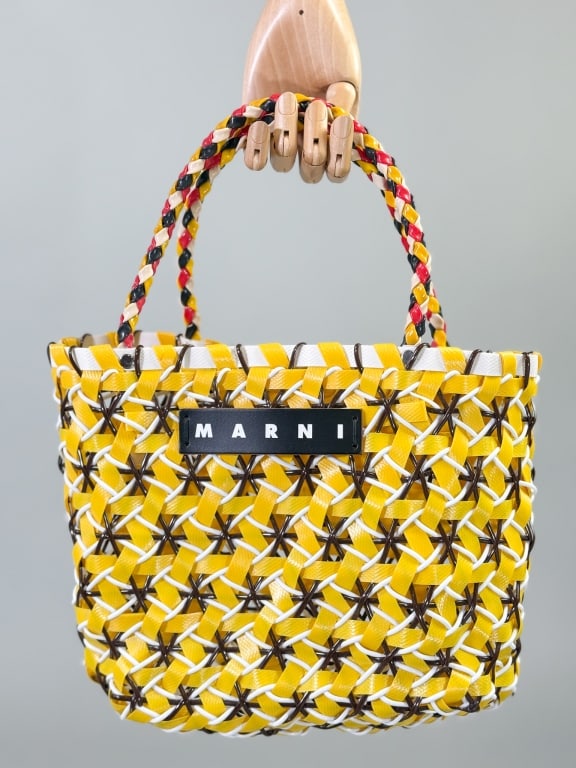 Marni Yellow Plastic Woven Top Handle Purse Bag: Marni Yellow Plastic Woven Top Handle Purse Bag Having braided top handles with woven body, leather logo plaque at front. Labeled made in Columbia. Measuring approximately 11 inches wide by 9 inches t