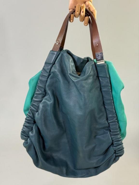 Marni Two-Tone Leather Hobo Shoulder Bag Purse: Marni Two-Tone Leather Hobo Shoulder Bag Purse Having ruched details throughout with removable cross-body and adjustable shoulder straps. Interior pockets, one zippered, labeled Marni, Made in Italy. 
