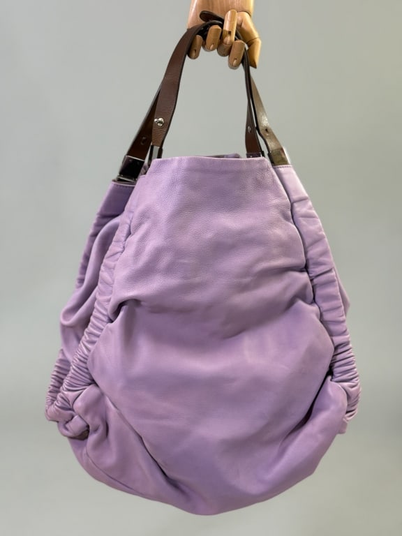 Marni Purple Leather Hobo Shoulder Bag Purse: Marni Purple Leather Hobo Shoulder Bag Purse Having ruched details throughout with removable cross-body and adjustable shoulder straps. Interior pockets, one zippered, labeled Marni, Made in Italy. Me