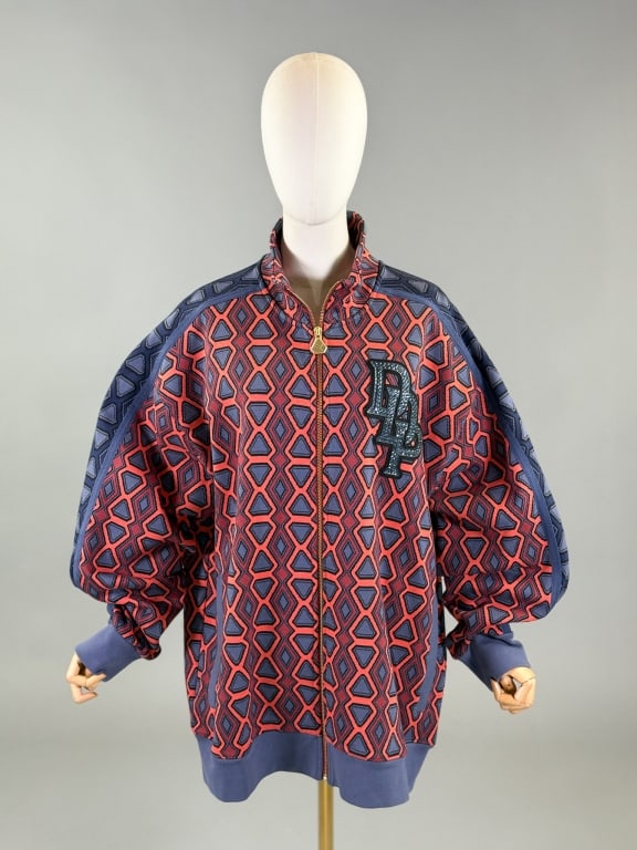 Puma Dapper Dan Knit Zip Front Sweater Jacket: Puma Dapper Dan Knit Zip Front Sweater Jacket Having zip front closure with two zippered pockets at side. Rhinestone details at front and back. Labeled Puma Dapper Dan, marked size XL, with tags attac