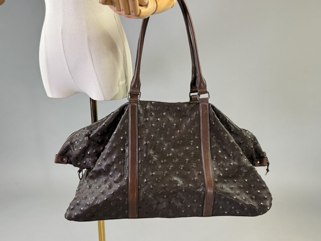John Varvatos Textured Leather Duffle Travel Bag: John Varvatos Textured Leather Duffle Travel Bag Having studded texture throughout with adjustable straps, zippered closure and zippered pockets throughout. Labeled John Varvatos, Italian Leather. Mea