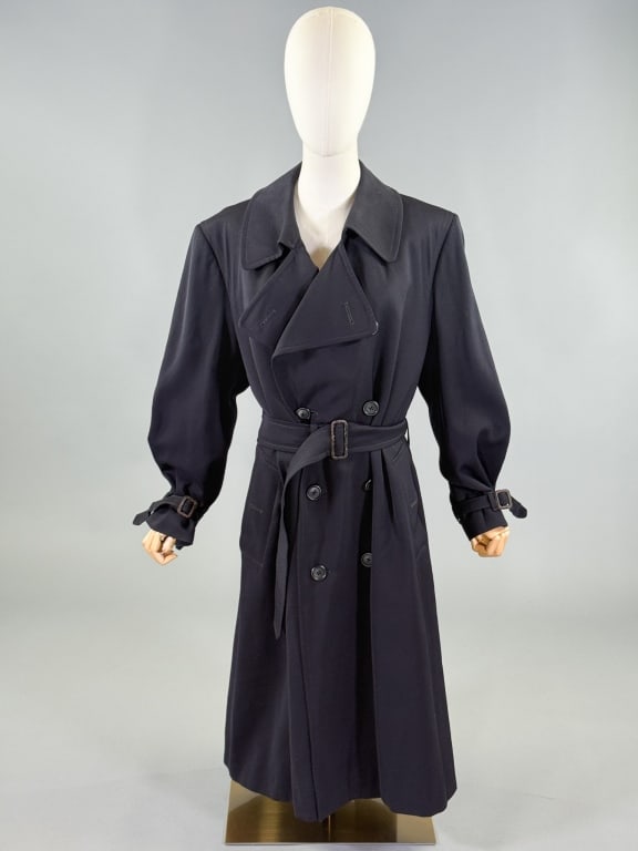 Vintage 1990s Burberrys Wool Trench Coat Jacket: Vintage 1990s Burberrys Wool Trench Coat Jacket having double breasted button front closure with belt at waist & fully lined. Labeled Burberrys Made in England. Measuring 46 inch chest, 44 inches long