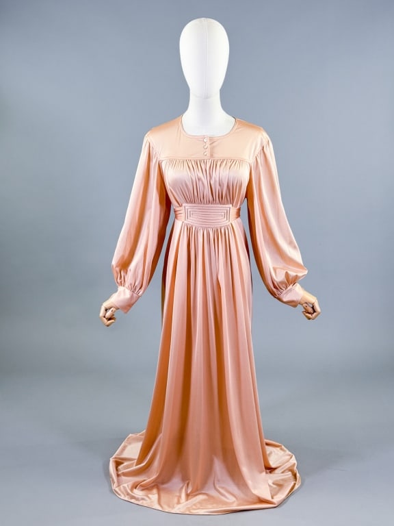 Vintage 1970s Miss Dior Pink Knit Night Gown Dress: Vintage 1970s Miss Dior Pink Knit Night Gown Dress having rounded neckline with buttons, bishop sleeves, & quilted detail at waist with tie. Labeled Miss Dior - 100% Nylon. Measuring 36 - 48 inch bust