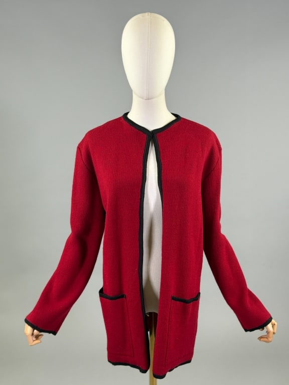 Vintage 1980s Christian Dior Knit Wool Sweater: Vintage 1980s Christian Dior Knit Wool Cardigan Sweater having open front with contrast black piping around edges with two front patch pockets. Labeled Christian Dior The Suit Paris New York - marked 
