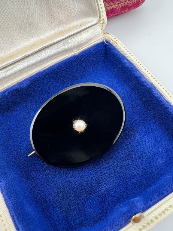 Antique 14kt Gold & Black Onyx Mourning Pendant: Antique 14kt Gold & Black Onyx Mourning Pendant or Brooch w Pearl. Frame and bail acid test for 14kt gold. Set with black onyx panel and pearl at center. Measures 1.75 x 1.25 inches.