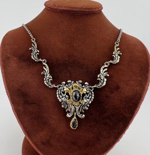 Antique Austro Hungarian Gold & Silver Necklace: Antique 19th C Austro Hungarian Gold & Silver Necklace. Tests as silver and 10kt gold, set with rose cut garnets. Measures just over 16 inches in length.