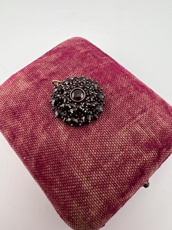 Antique 19th C 10k Gold Silver & Garnet Pendant: Antique 19th C 10k Gold Silver & Garnet Pendant. Rose cut garnet set necklace pendant mounted in silver with bail / mount that acid test for 10kt gold. Measures 1 inch in length.