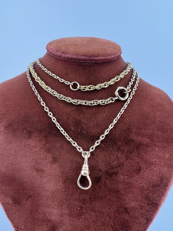 Antique 19th C Gold Filled Watch Chain Necklace: Antique 19th C Gold Filled Watch Chain Necklace. Featuring a rope twist motif chain and an oval rolo link chain. Set with spring ring clasp and dog clip for pendant or charms. Chains measures 28 inche