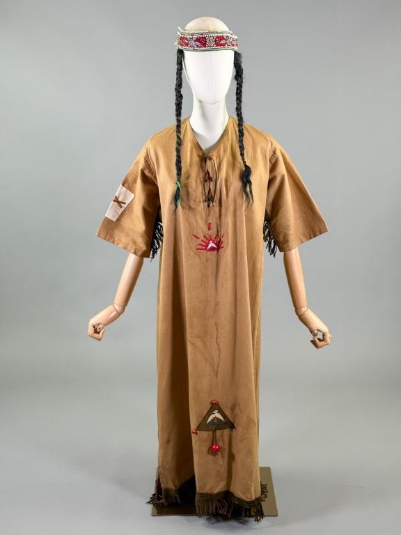 Antique 1920s Camp Fire Girls Native Costume Dress: Antique 1920s Camp Fire Girls Native Costume Dress having leather fringed edges and lace up front, embroidery, and beaded headband with attached pigtails. Labeled Camp Fire Girls. Measuring 42 inch bu