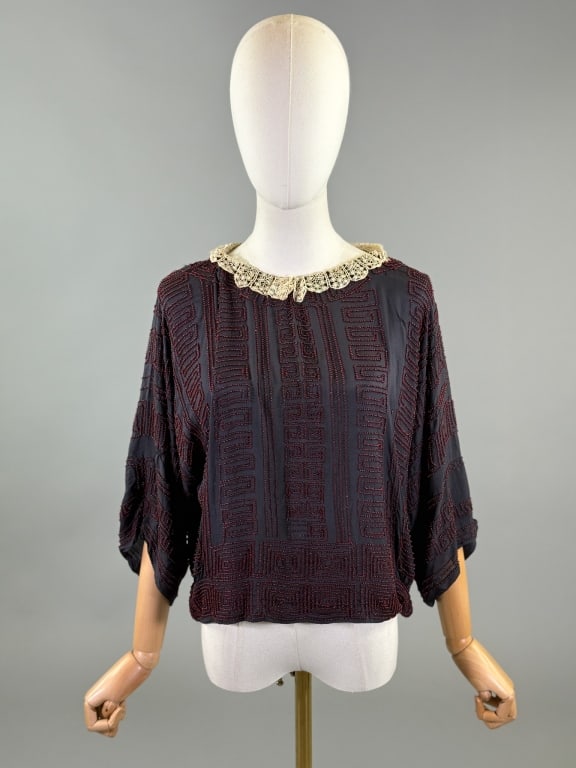 Antique 1920s Greek Key Beaded Flapper Blouse Top: Antique 1920s Greek Key Beaded Flapper Blouse Top having lace detail at neck & glass beaded Greek key design through body, no closures slides over head. Measuring 46 inch bust, 36 inch waist, 20 inche