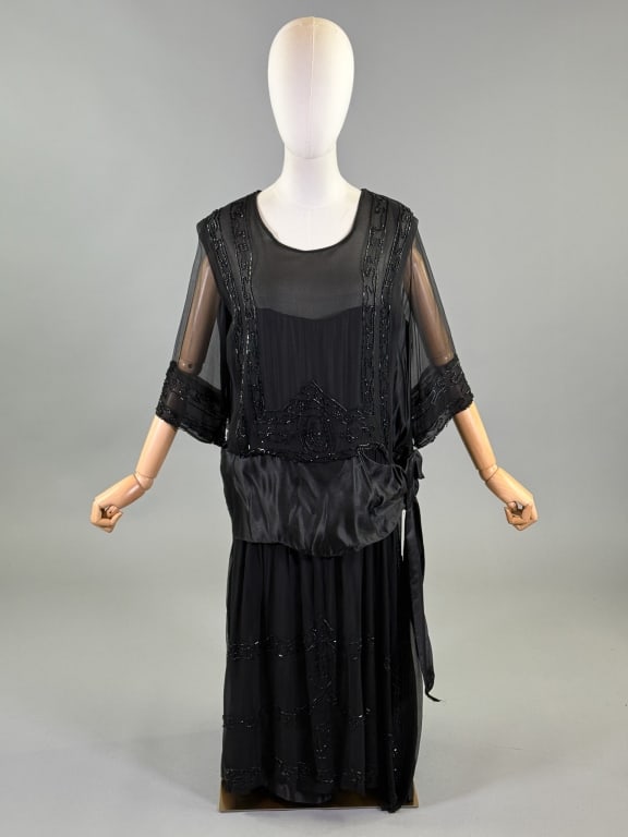Antique 1920s Silk Chiffon Beaded Drop Waist Dress: Antique 1920s Silk Chiffon Beaded Drop Waist Dress having glass bead embellishments throughout with satin ribbon belt detail at drop waist, closing with snaps. Measuring 44 inch bust, 42 inch drop wai