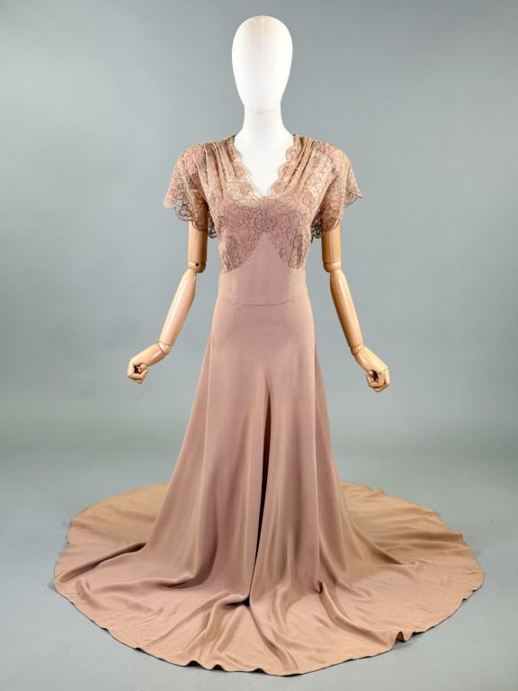 Vintage 1940s Rayon Crepe Lace Volup Evening Gown: Vintage 1940s Rayon Crepe Lace Volup Evening Gown having lace bodice with bias cut skirt, side zip closure. Measuring 42 inch bust, 36 inch waist, 60 inches long, 6 inch sleeve length. General wear th