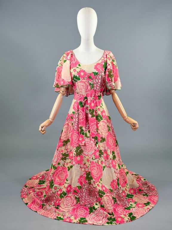 Vintage 1970s Floral Flutter Sleeve Maxi Dress: Vintage 1970s Floral Flutter Sleeve Maxi Dress having fluttered sleeves with long maxi skirt, tie at waist and center back zip closure. Labeled Daphne Logan - marked size 10. Measuring 36 inch bust, 2