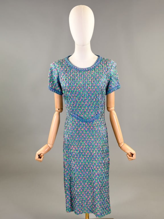 Vintage 1960s Colorful Ribbon Knit Shift Dress: Vintage 1960s Colorful Ribbon Knit Shift Dress having belted detail at center front with center back zip closure and woven ribbon details at neck and sleeve cuffs. Measuring 34 - 44 inch bust, 30 - 34