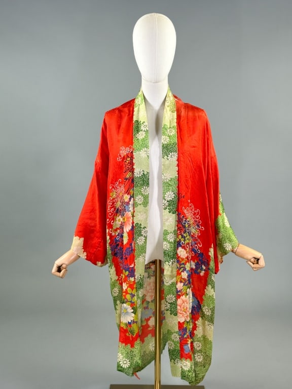 Vintage 1940s Japanese Silk Floral Robe Jacket: Vintage 1940s Japanese Silk Floral Robe Jacket having print throughout with open front. Measuring 43 inches long, 13 inch sleeve length. Wear as shown throughout, hole at shoulder, missing lining in s