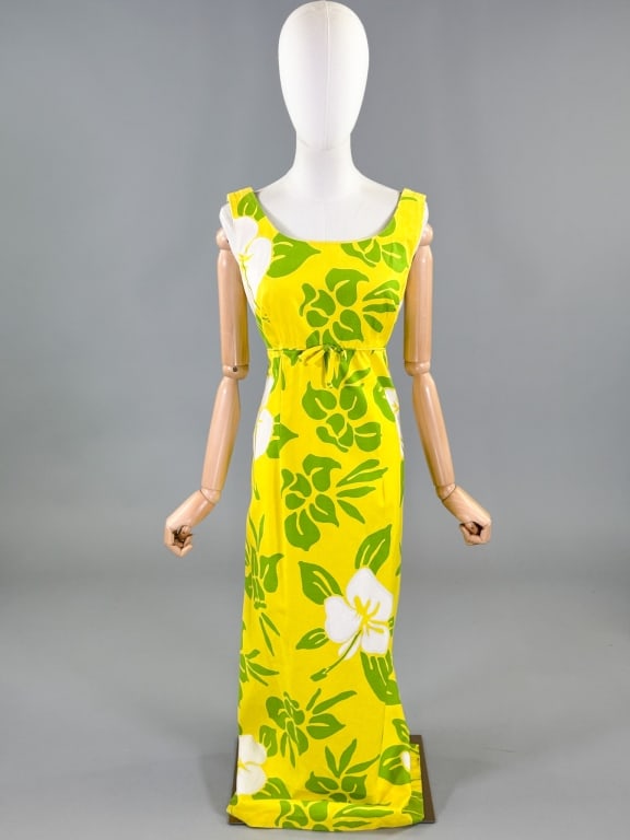 Vintage 1960s Hawaiian Hibiscus Empire Waist Gown: Vintage 1960s Hawaiian Hibiscus Empire Waist Gown Dress having bow detail at front with floral print throughout and center back zip closure. Labeled Pomare-Tahiti. Measuring 36 inch bust, 30 inch wais